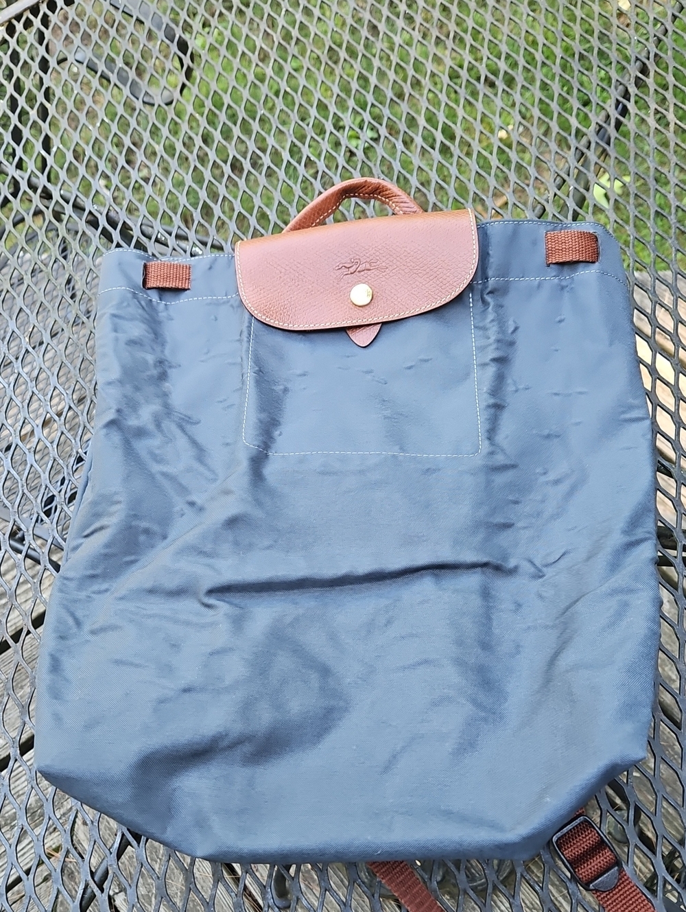 Longchamp navy nylon backpack with brown leather flap
